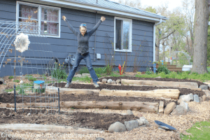woman with raised beds garden