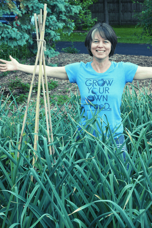 garlic and woman in garden