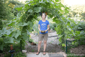 woman under trellis in garden