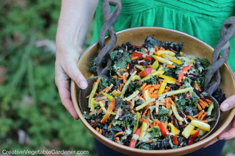 woman holding kale salad