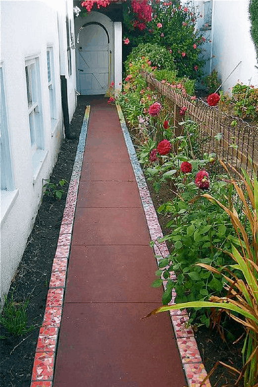 photos of vegetable gardens with mosaic path