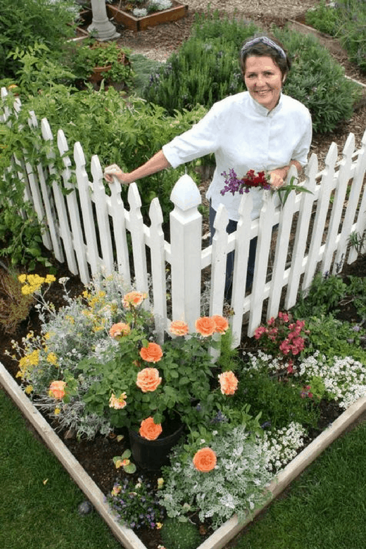 pictures of vegetable gardens with white fence and gardener