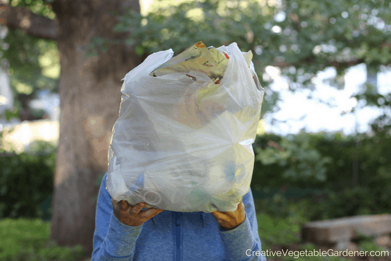 woman with bag of plastic for plastic free living