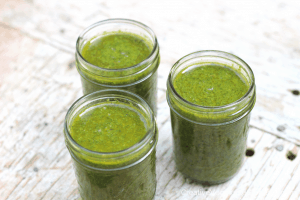 jars of cilantro sauce preserved for winter