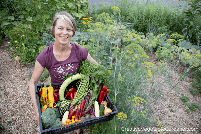 woman with large organic garden harvest